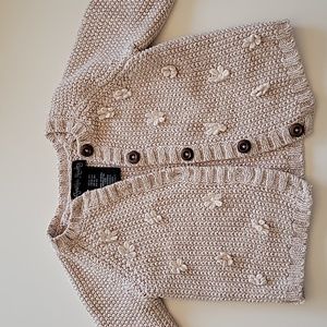 100% cotton knitted baby cardigan with flower details and wooden buttons